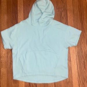 Never worn Fabletics medium size baby blue teal Hadley Hi-low sleev tee hoodie